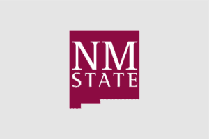 New Mexico State University logo featuring maroon and white colors with the initials NM State in a stylized design.